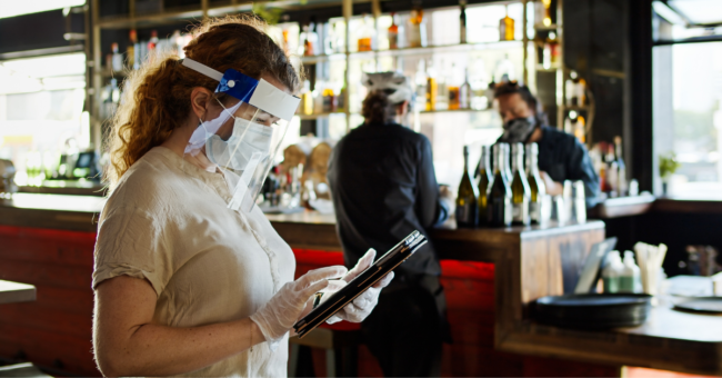 Woman in Restaurant on Tablet